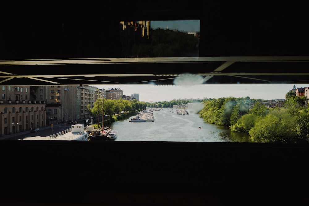 white and black boat on river during daytime