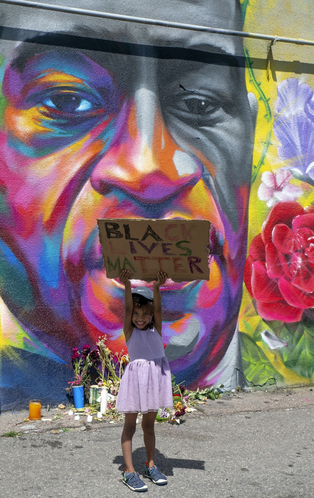 womans face with pink flower on head painting