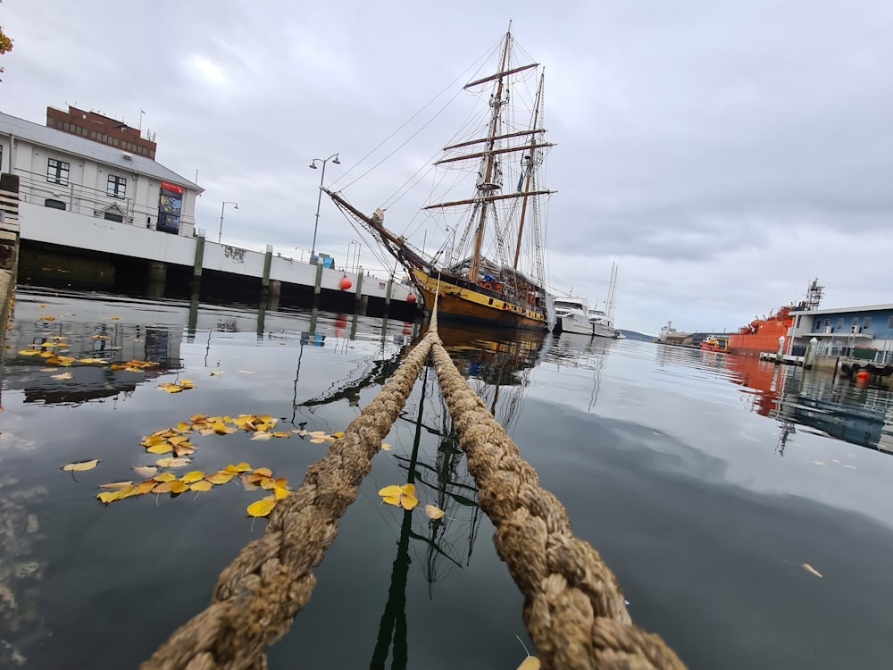 brown ship on body of water during daytime