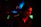 Close-up of a music fan enjoying headphones in a cozy, dark room with blue and violet lighting.