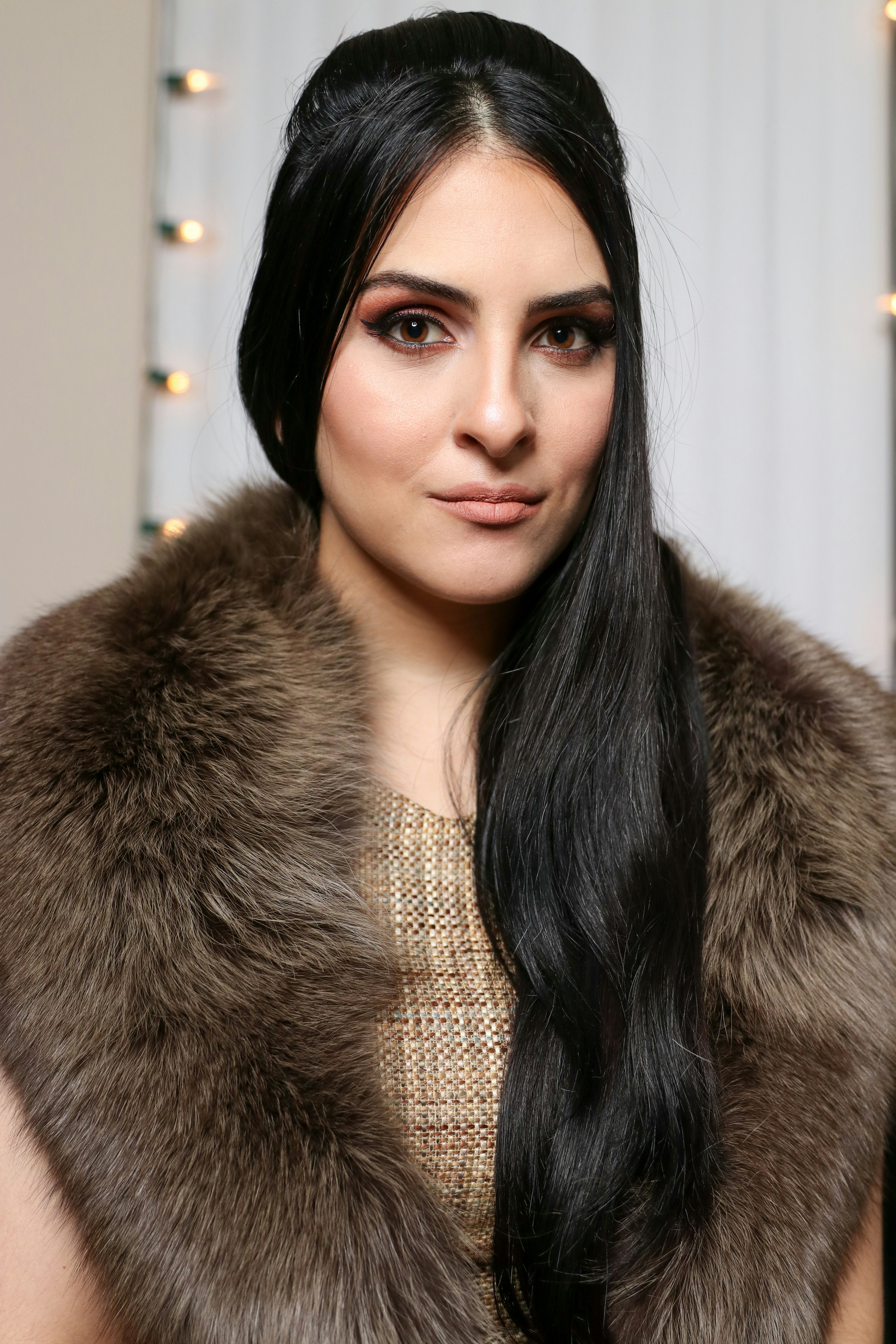 woman in brown fur coat