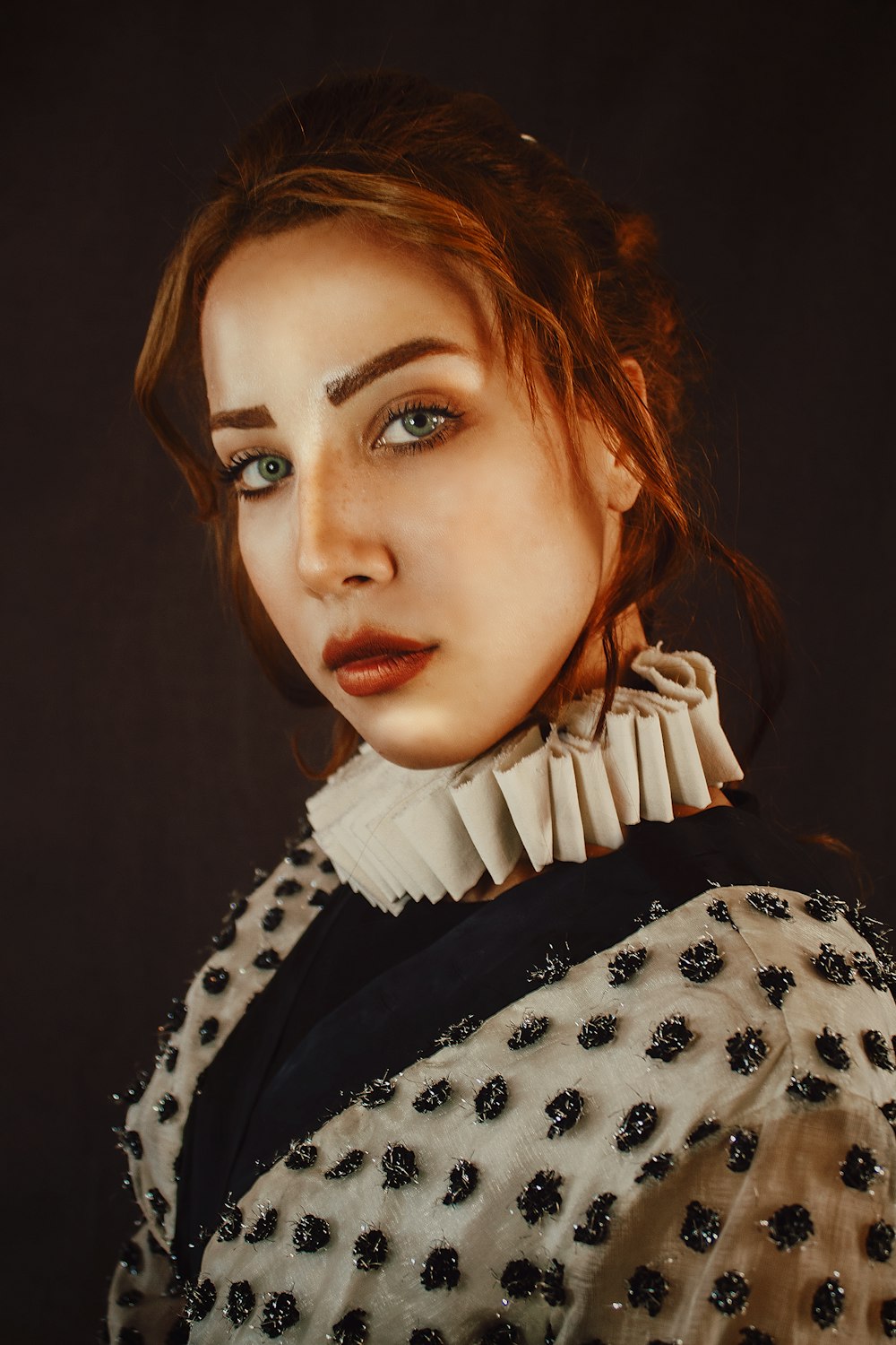 woman in black and white polka dot shirt