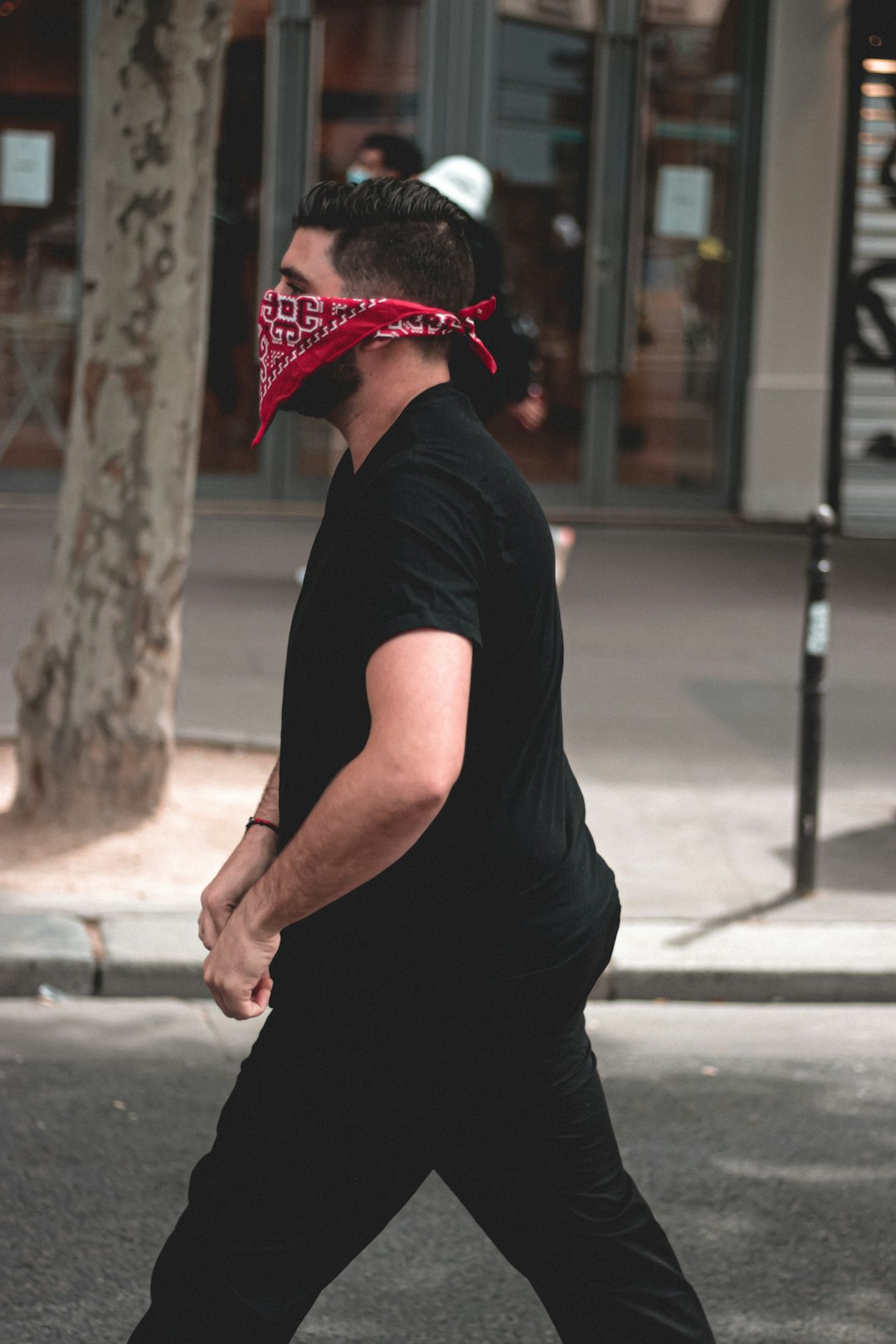 man in black t-shirt wearing red hat