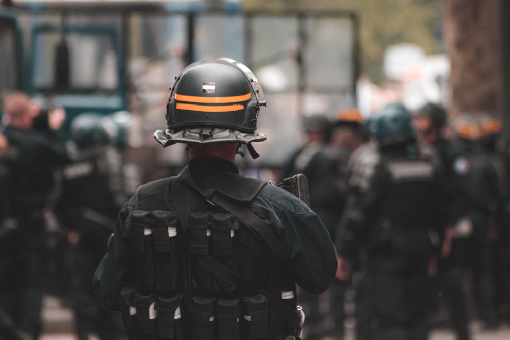 man in black jacket wearing helmet