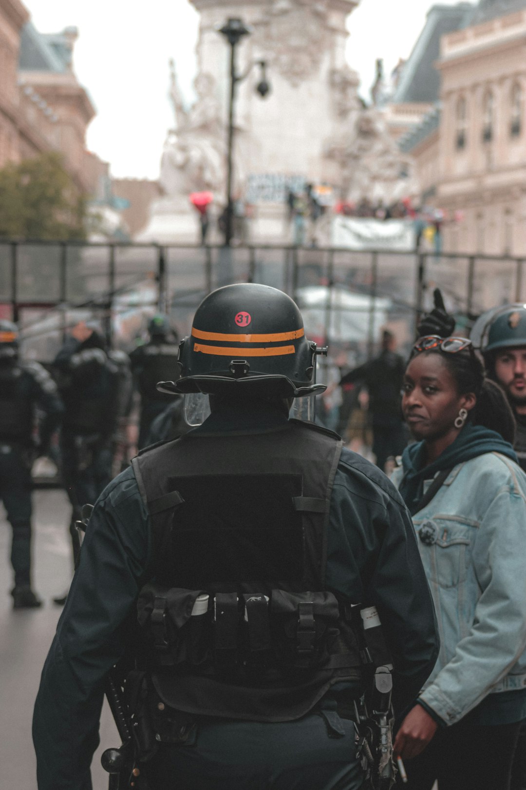 people in black and yellow helmet and black jacket