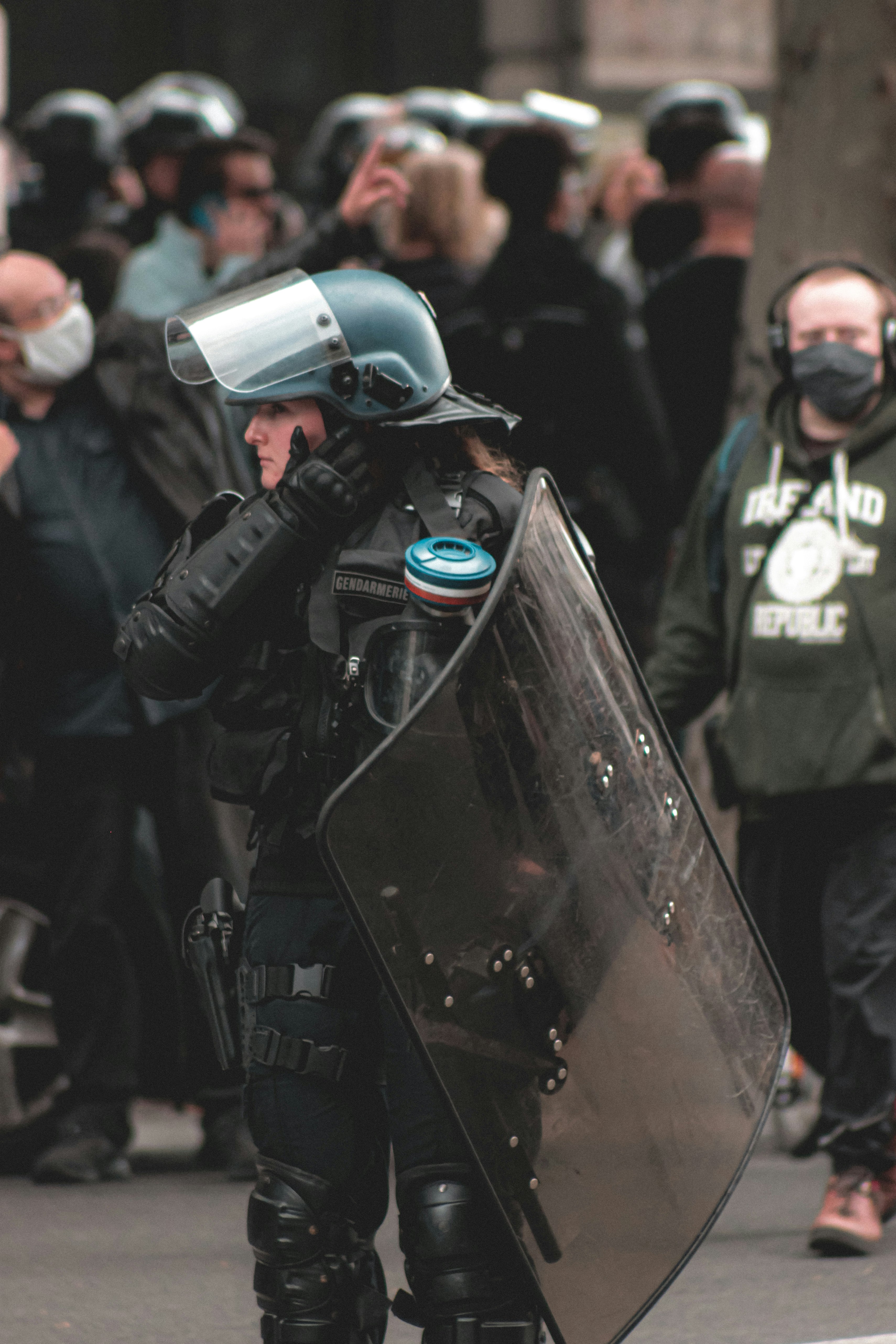 man in black jacket wearing black helmet and black helmet holding black dslr camera