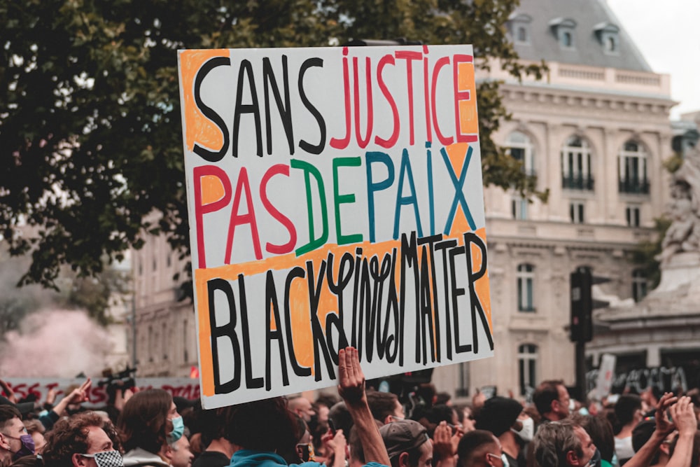 people holding happy birthday signage during daytime