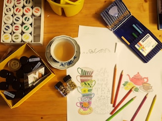 black and white ceramic mug on brown wooden table