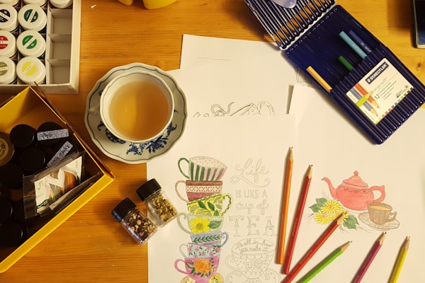 black and white ceramic mug on brown wooden table