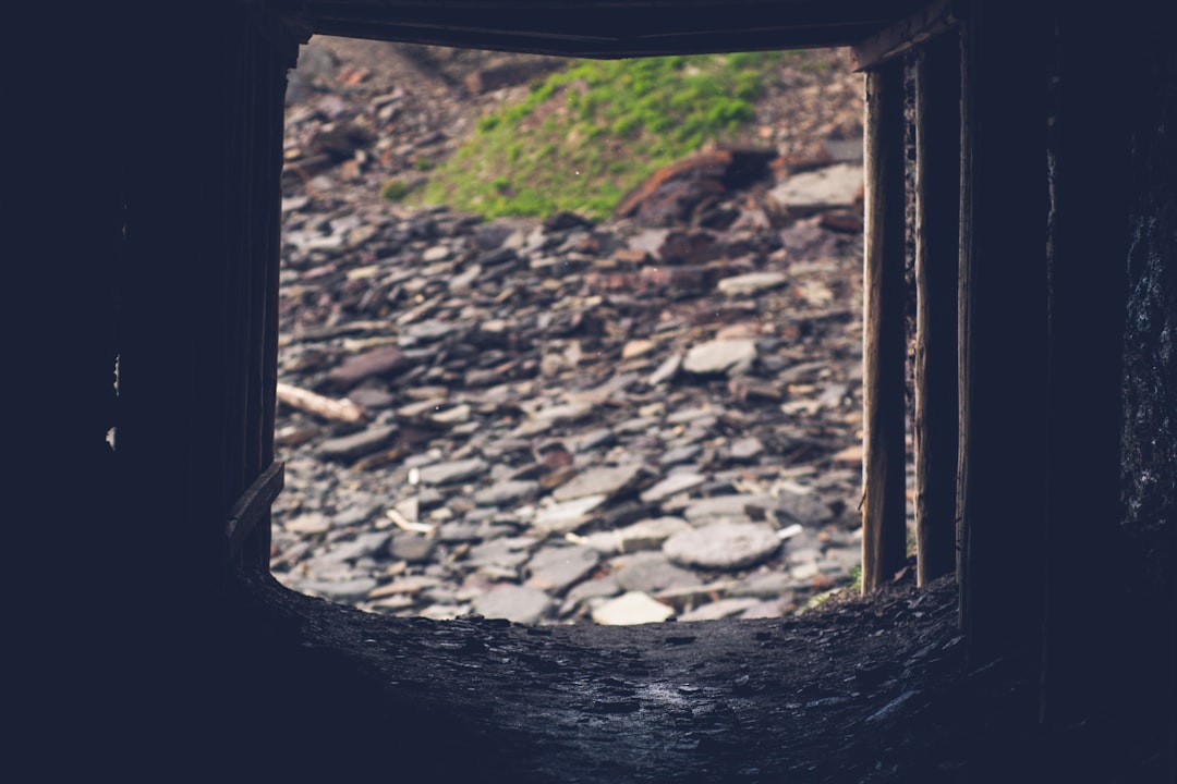 brown wooden frame on rocky ground