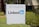 A sign with the address 605 W Maude Ave and the LinkedIn logo is surrounded by greenery and trees.
