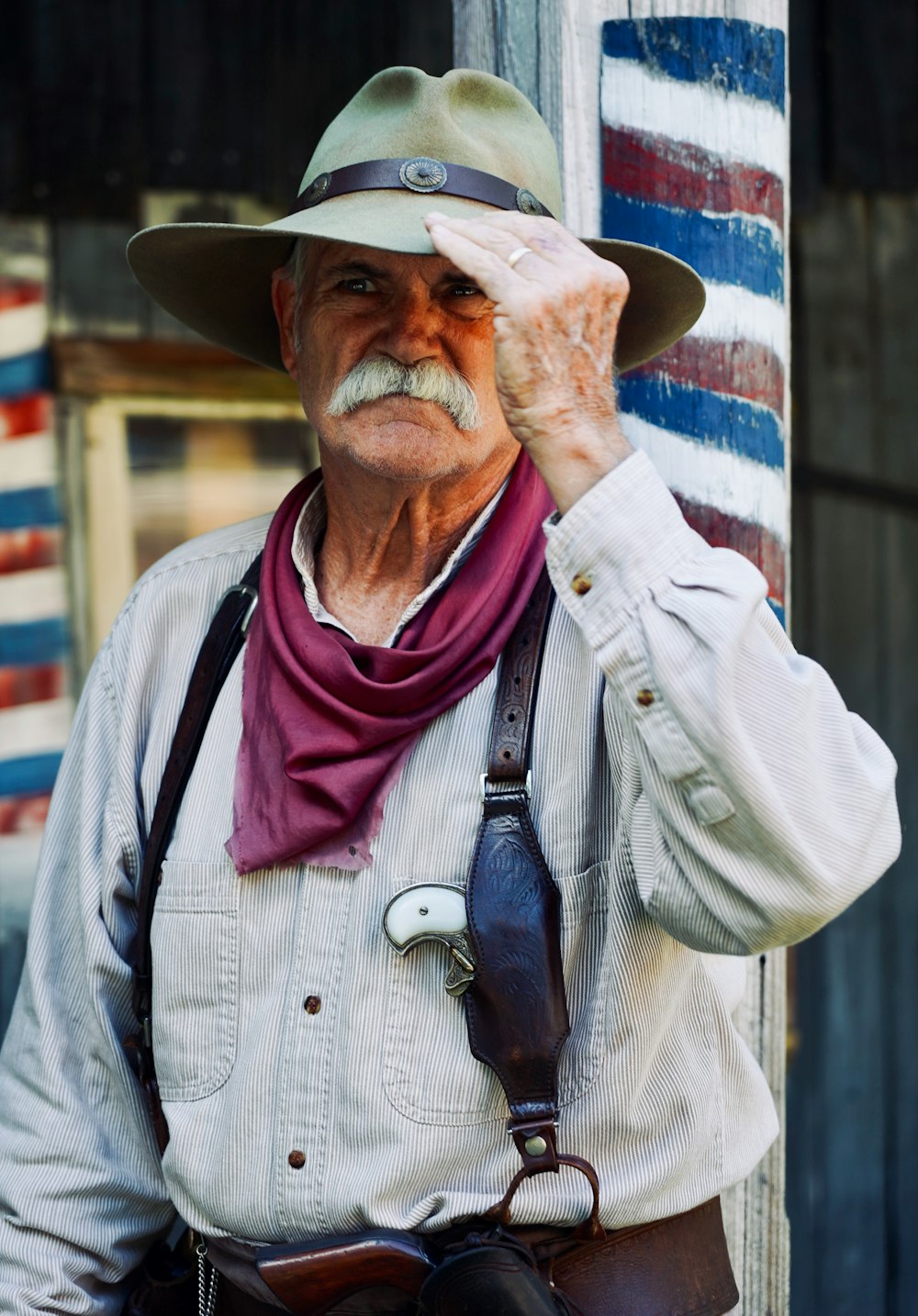 man in white button up shirt wearing brown cowboy hat