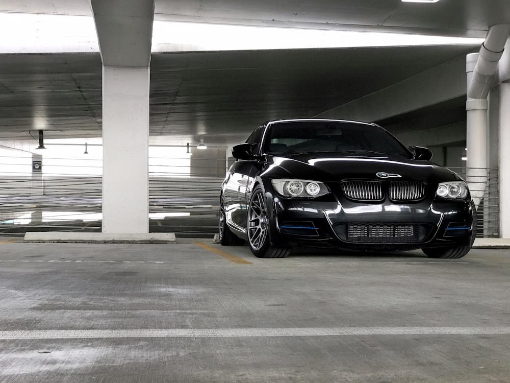 black bmw m 3 coupe parked in a parking lot