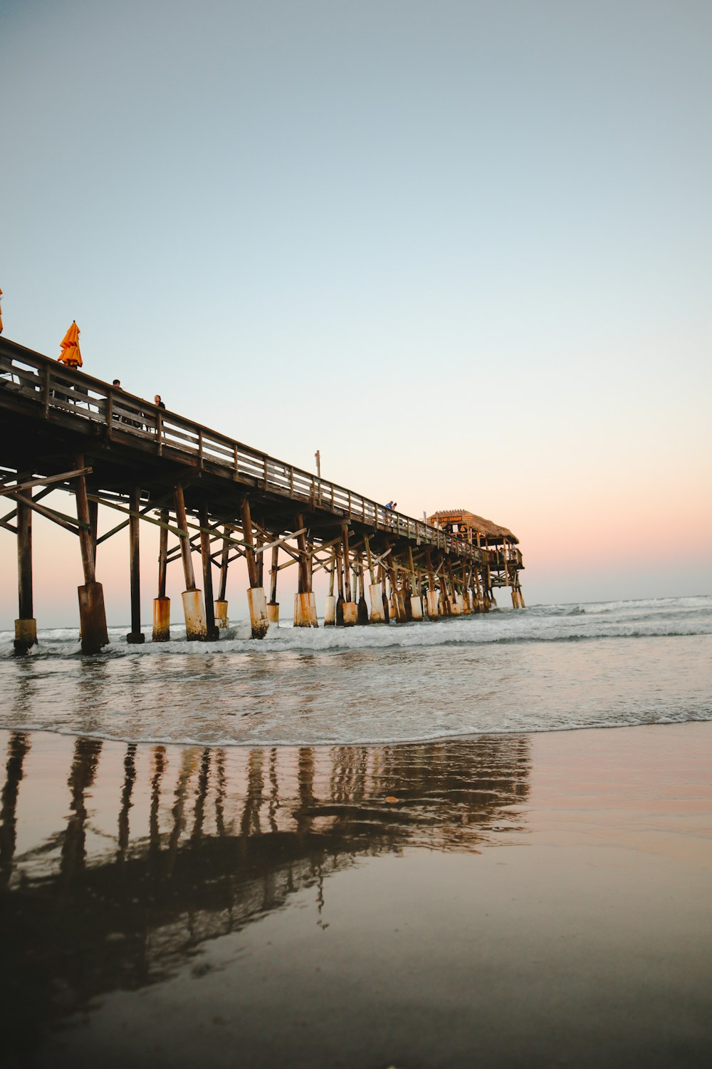 brown wooden dock on sea during daytime