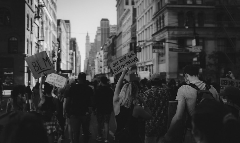 grayscale photo of people walking on street