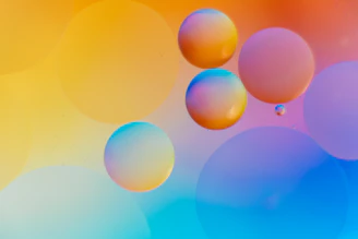 Colorful bubbles bursting on a lively game screen with playful background.