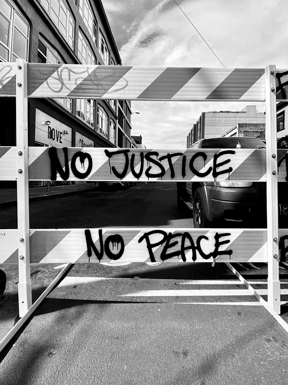 a black and white photo of a no justice sign