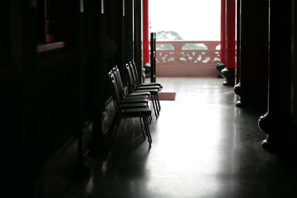 brown wooden armchair on white floor tiles