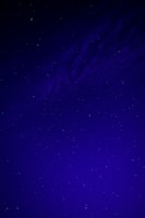 A dark blue night sky filled with bright white stars arranged in a subtle cross pattern.