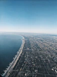 aerial view of city near body of water during daytime