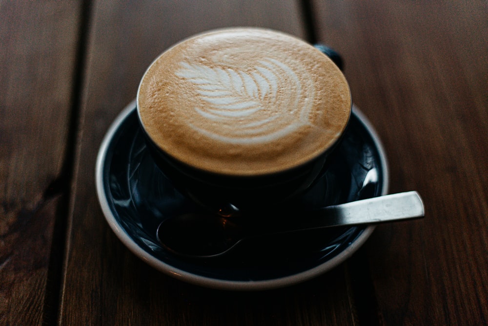 black ceramic cup with saucer