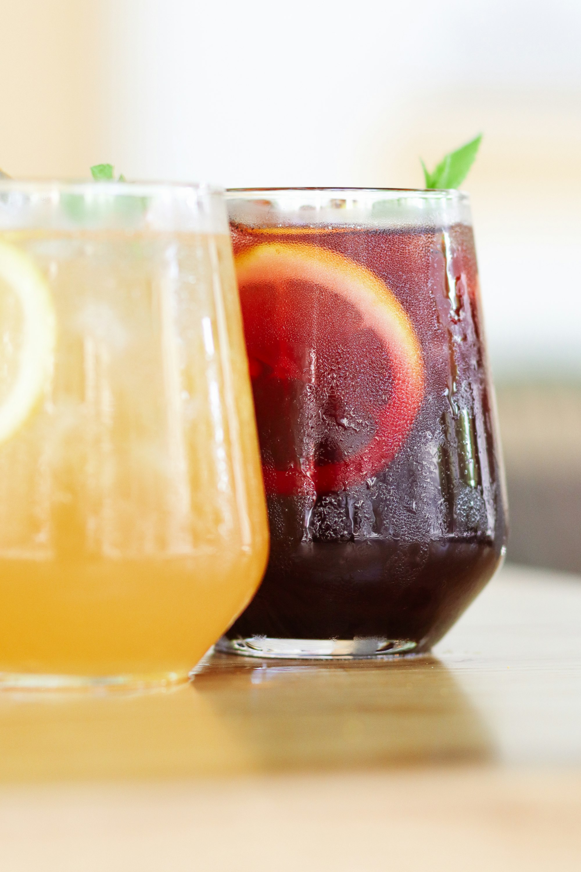 clear drinking glass with orange liquid