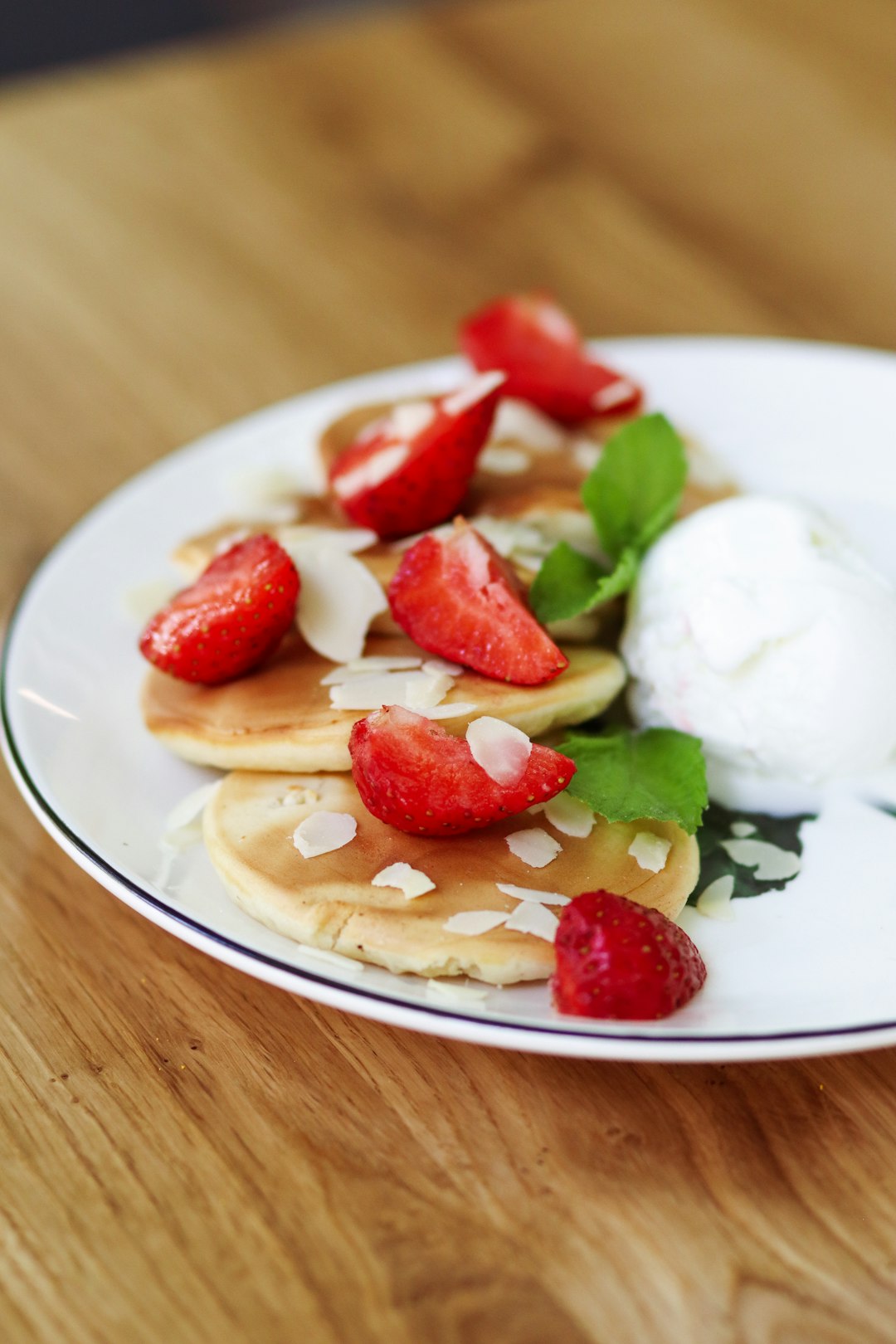 sliced strawberries on white ceramic plate