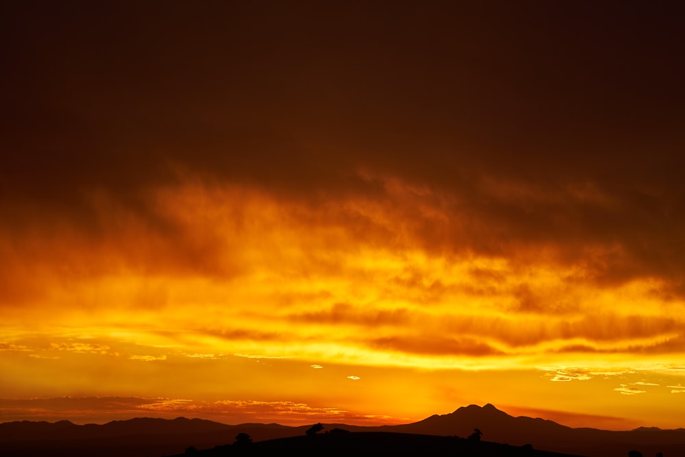 silhouette of mountain during sunset