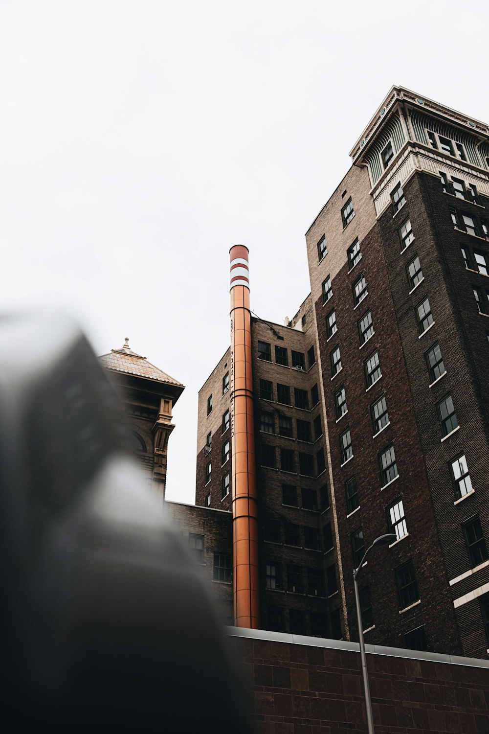 brown concrete building under white sky during daytime