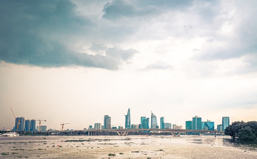 city skyline under white clouds during daytime