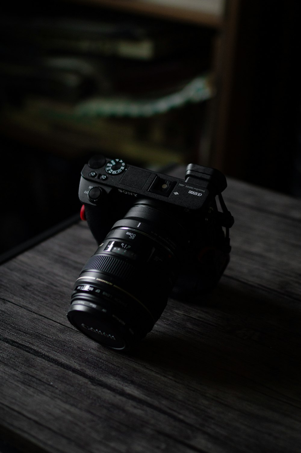 black nikon dslr camera on brown wooden table