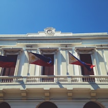 white and brown concrete building under blue sky during daytime