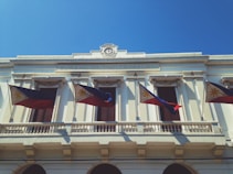 white and brown concrete building under blue sky during daytime