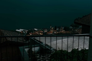 View from the Shore View room balcony showing the nearby village shops and shore.