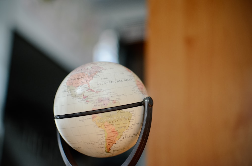 white and brown desk globe