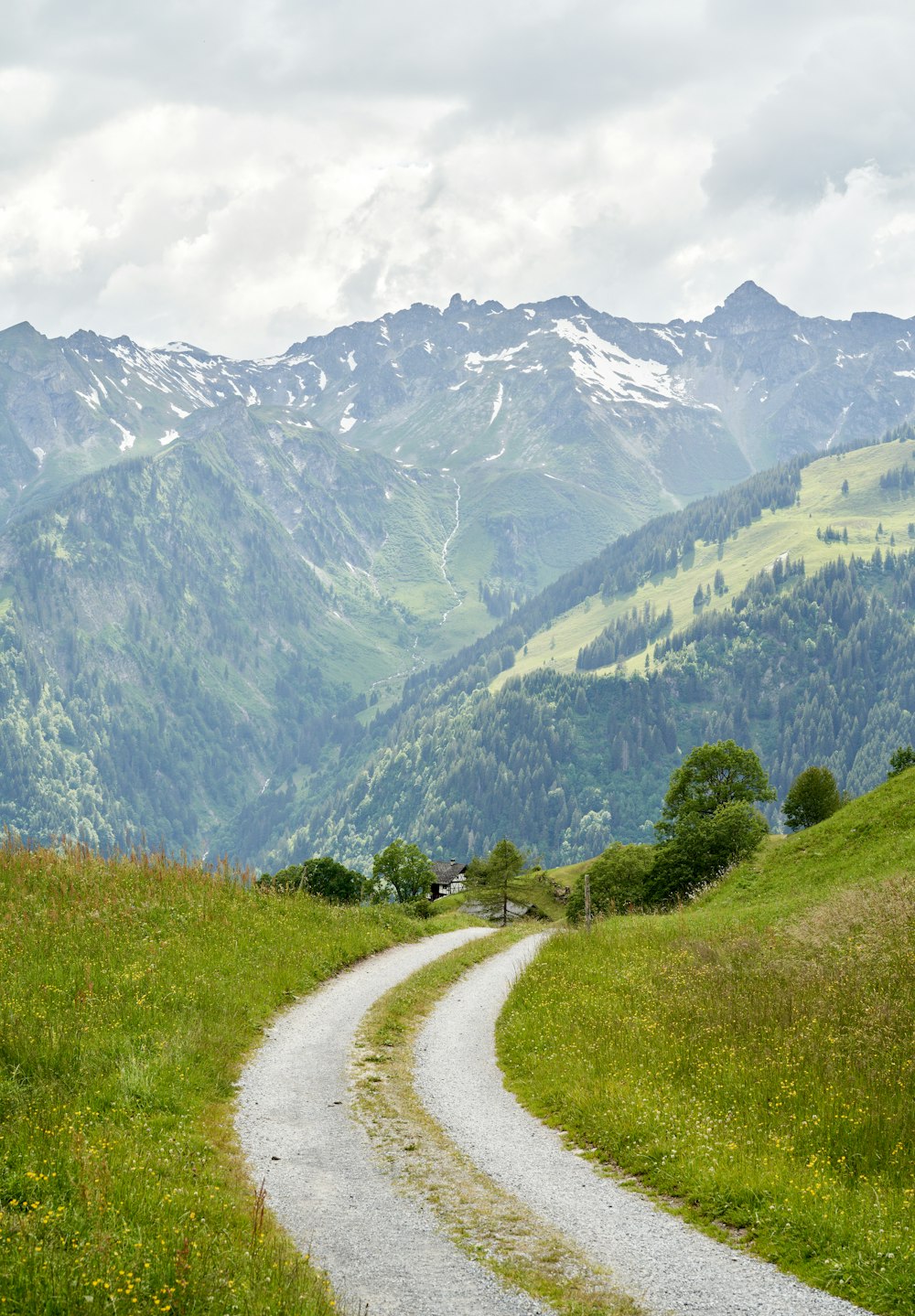 green grass field near mountain during daytime