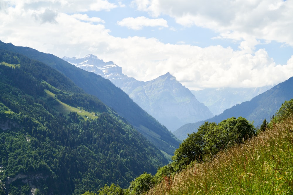 green mountains under white clouds during daytime