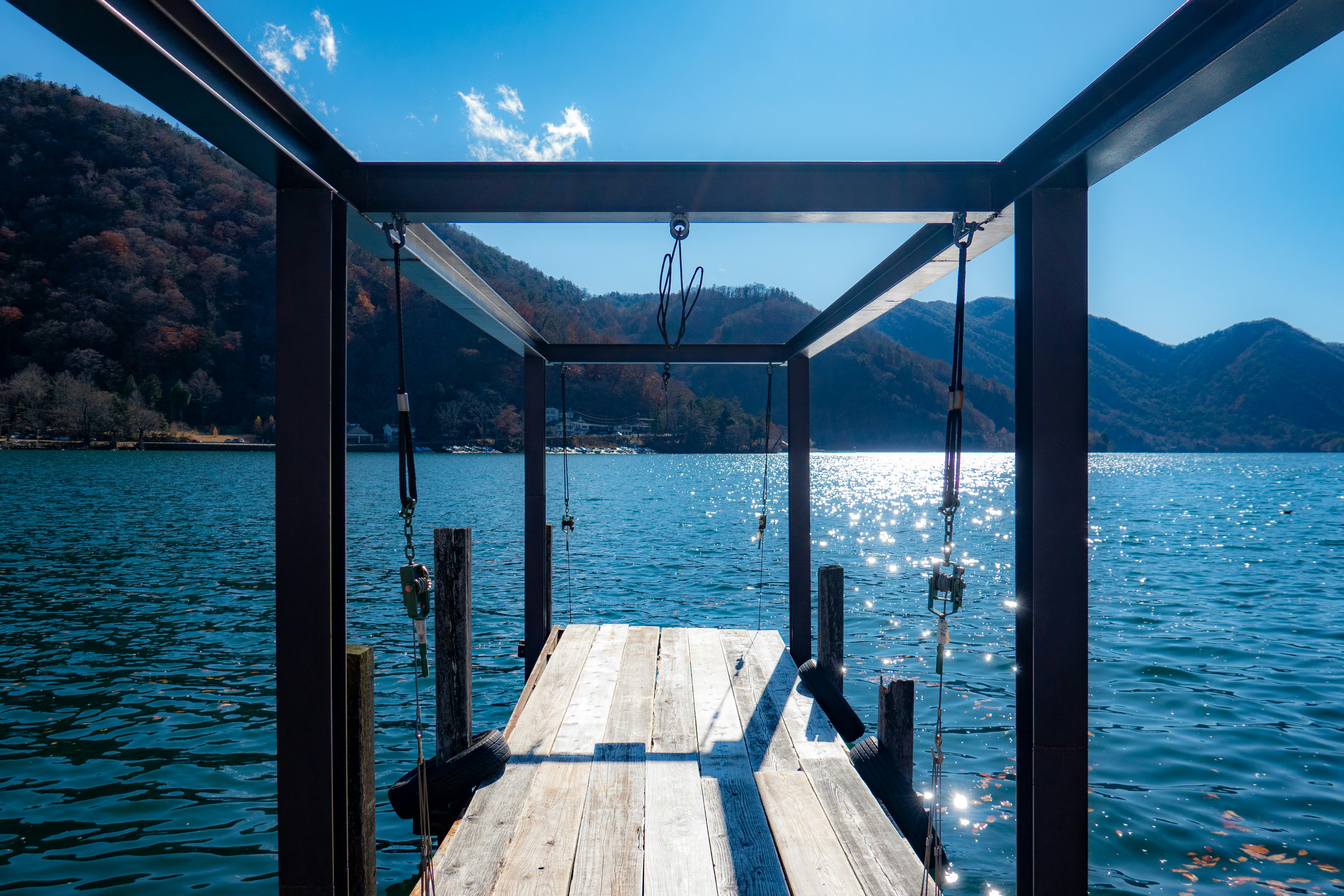brown wooden dock on sea during daytime