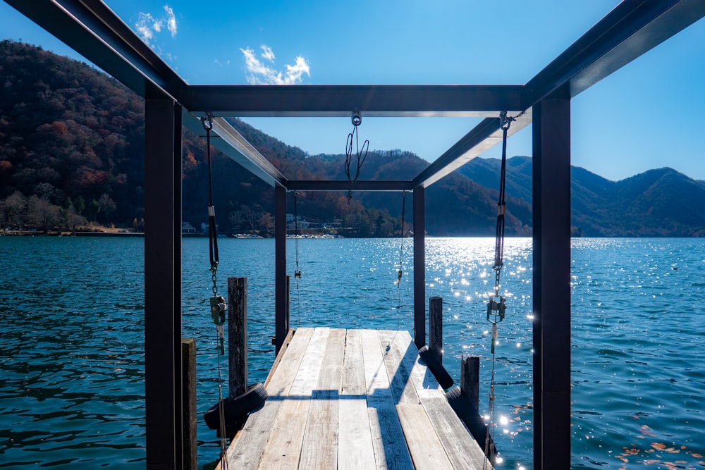 brown wooden dock on sea during daytime