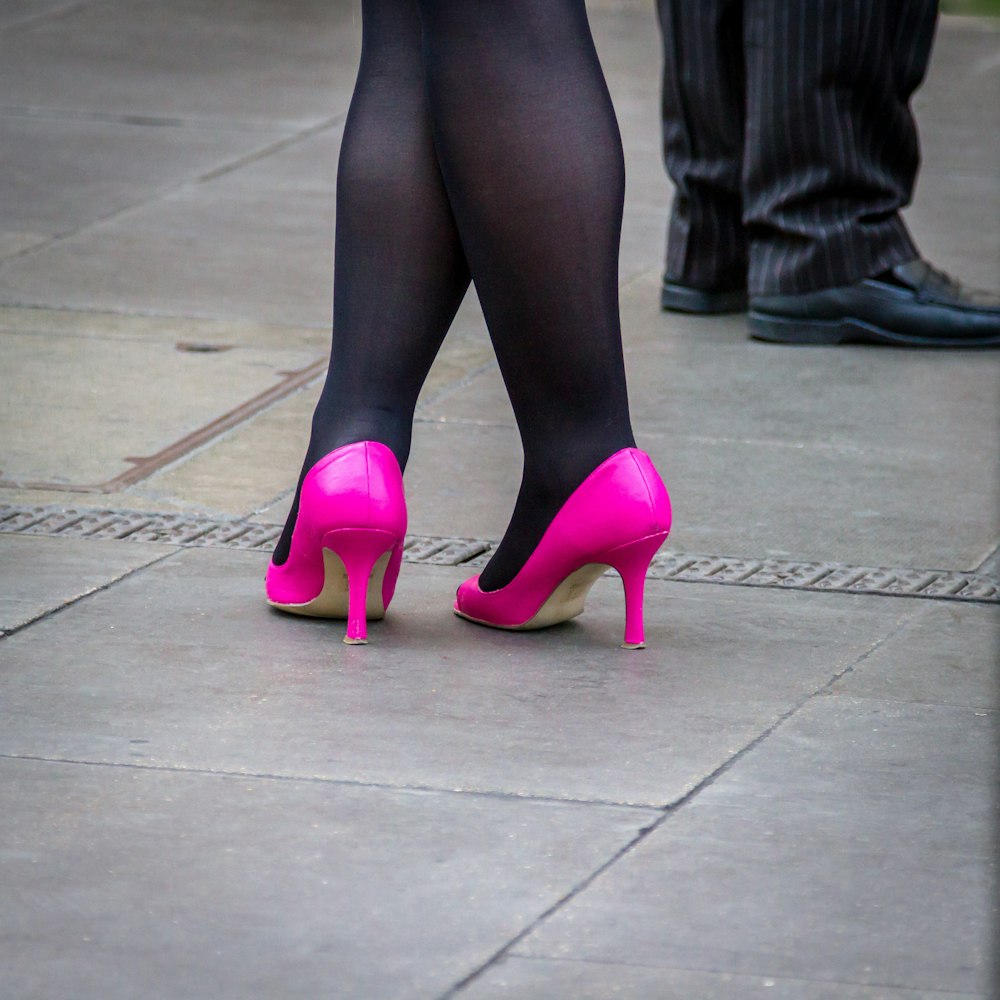 woman in pink leather pumps
