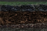 Close-up of soil layers exposed during a geotechnical survey.