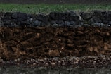 3D cutaway of soil layers beneath a luxury condominium complex