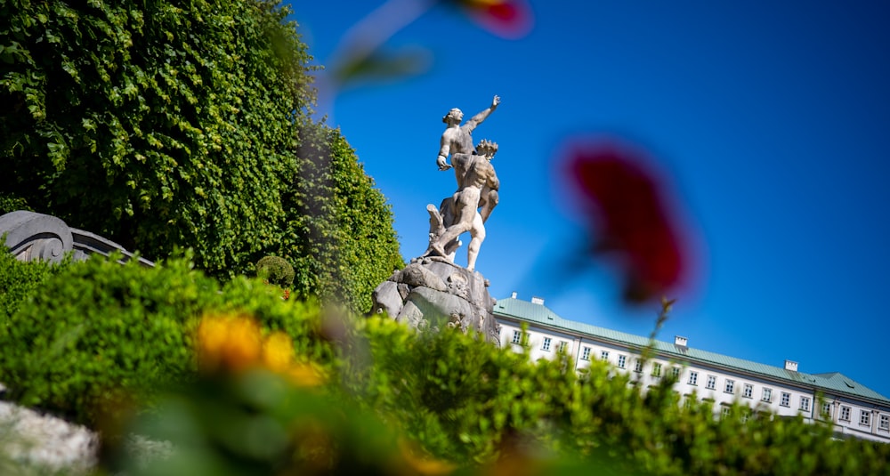 statue of man on top of rock