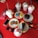An assortment of colorful desserts and drinks on a bright red table, including various milkshakes topped with whipped cream and chocolate syrup, colorful macarons, cookies, slices of chocolate cake, a smartphone, sunglasses, and a wallet.