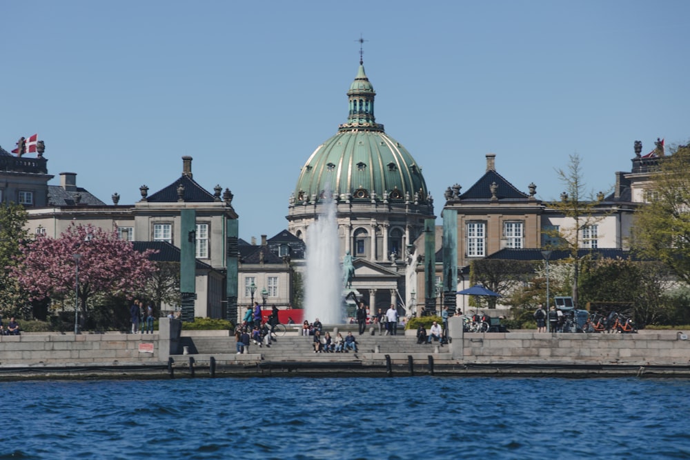 fountain in front of building during daytime