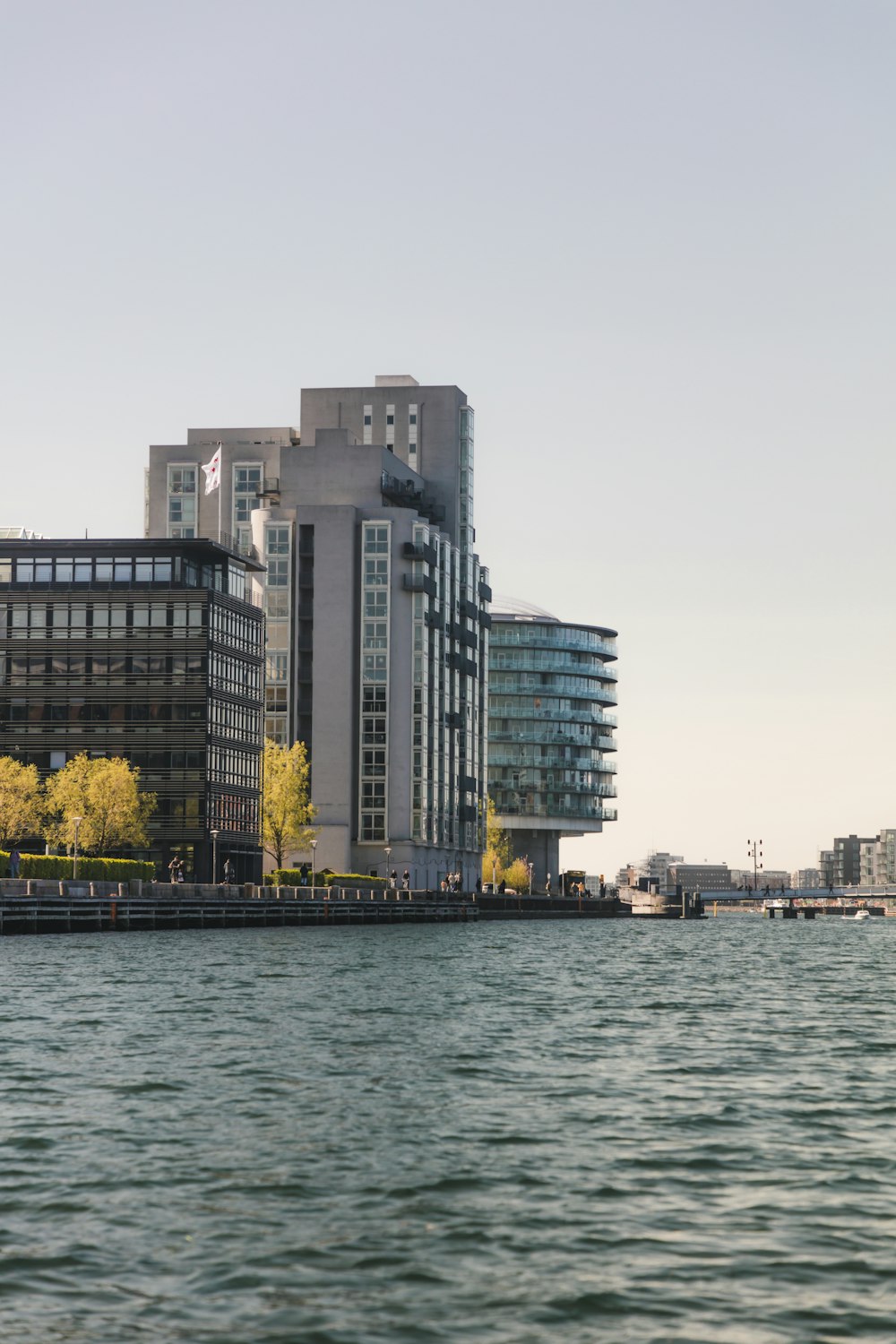 body of water near city buildings during daytime