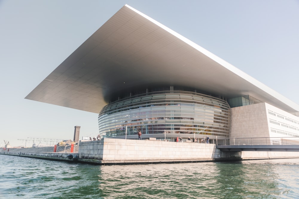 brown concrete building near body of water during daytime