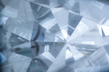 A jeweler’s loupe inspecting a gemstone’s facets under bright light.