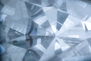 A jeweler’s loupe inspecting a gemstone’s facets under bright light.