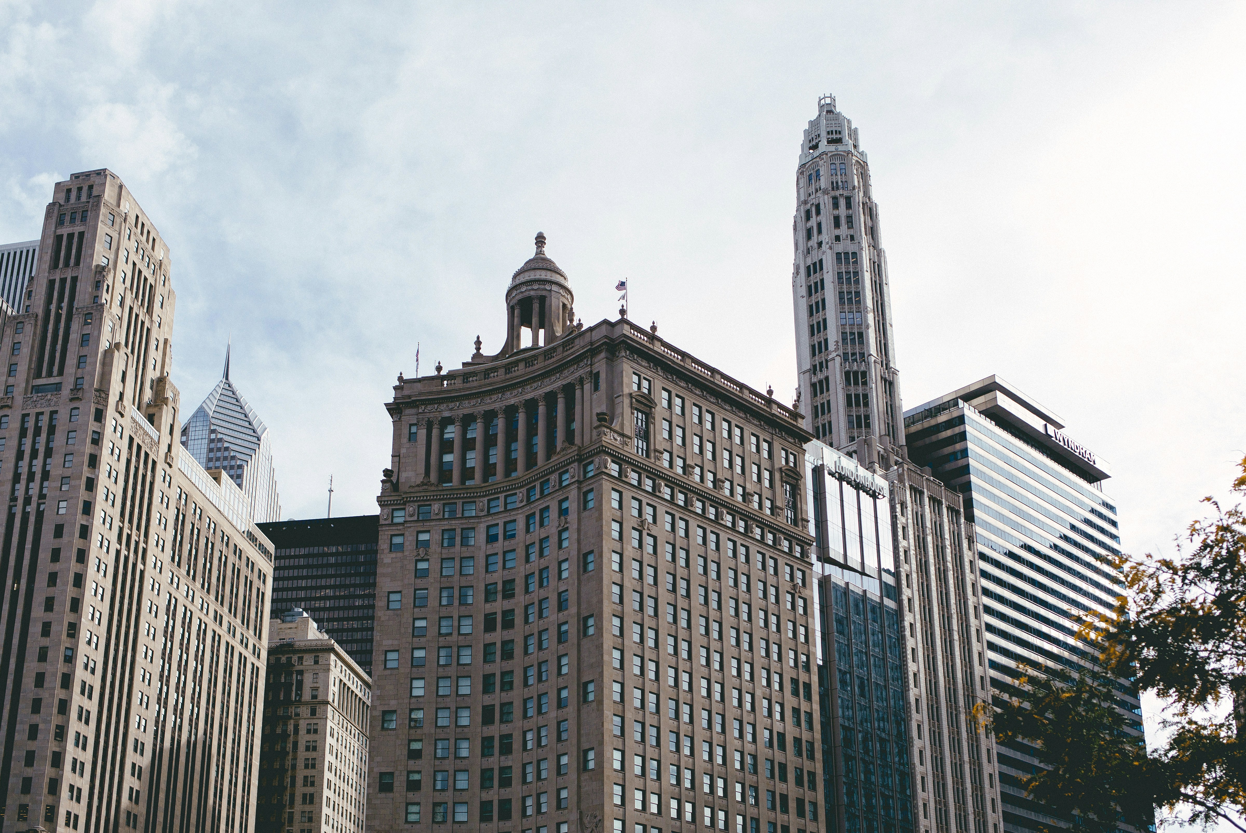 brown and white concrete building under white clouds during daytime